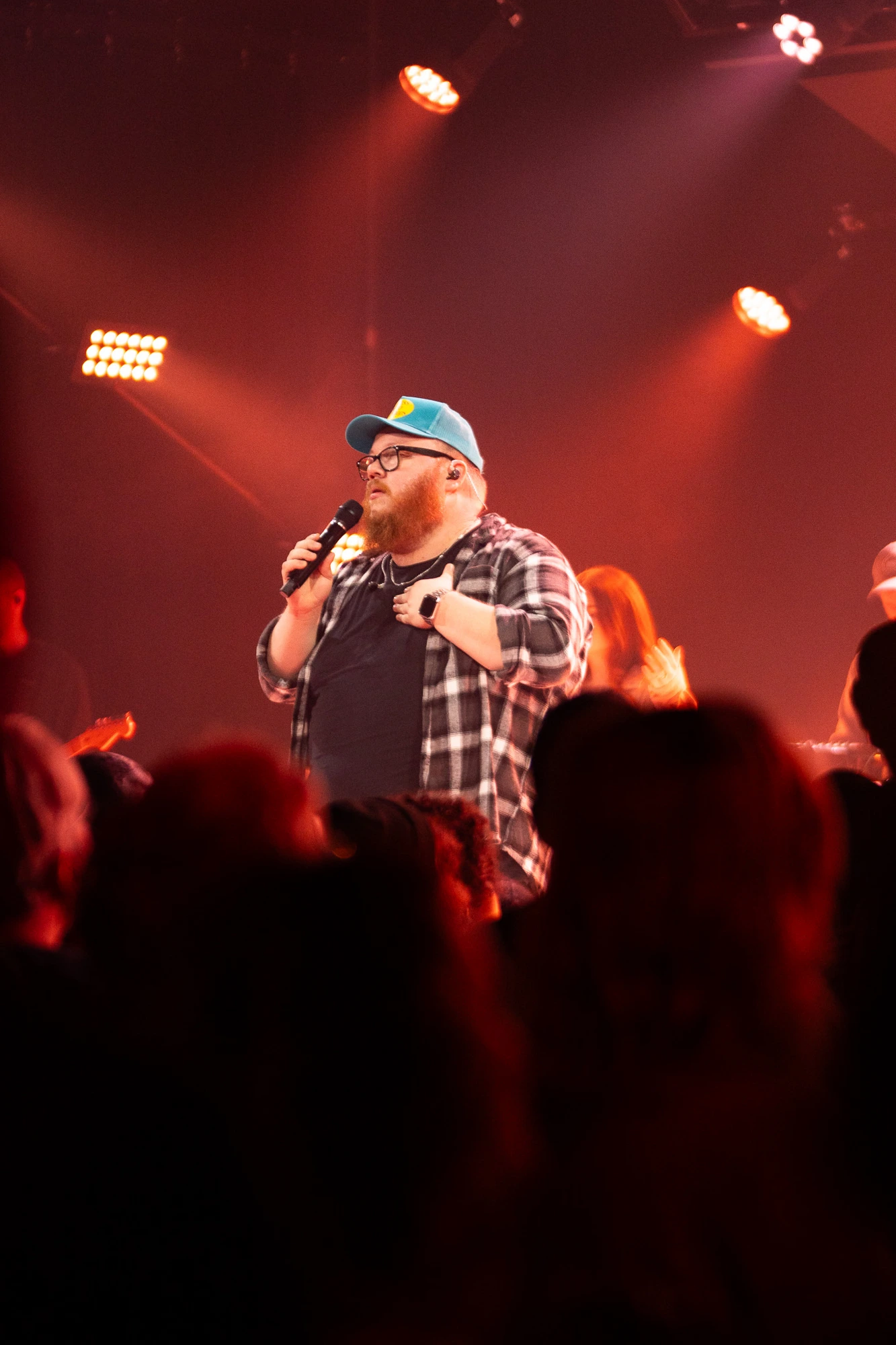 David Rosenblum speaking into a microphone on stage