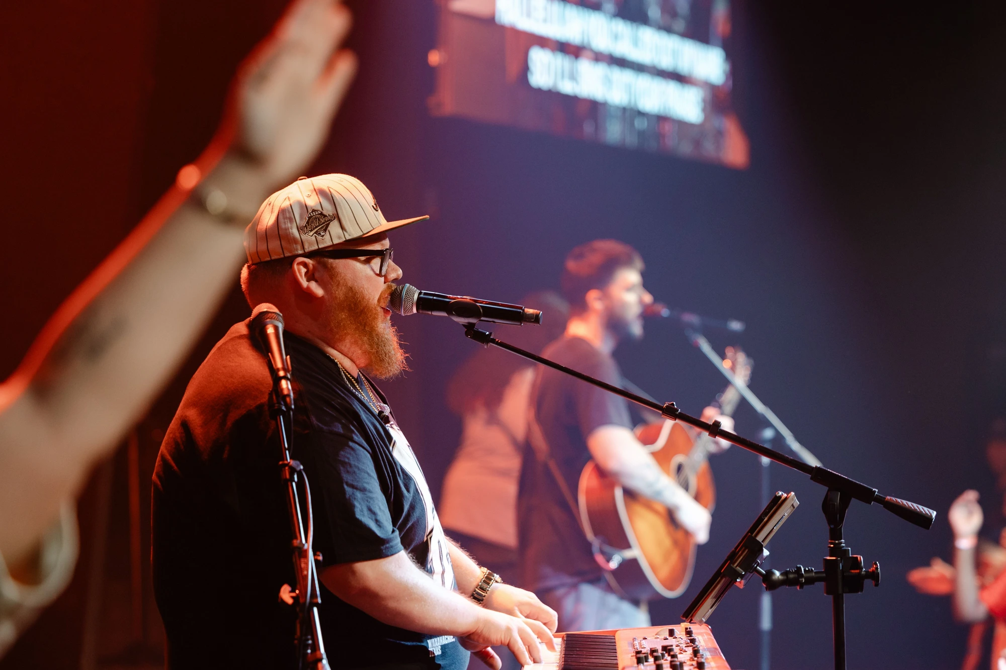David talking with a worship leader at the keys